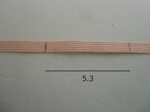 編み紐を解いて印の長さを測定